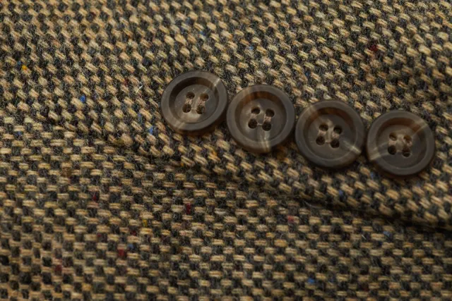 Buttons on a tweed jacket sleeve